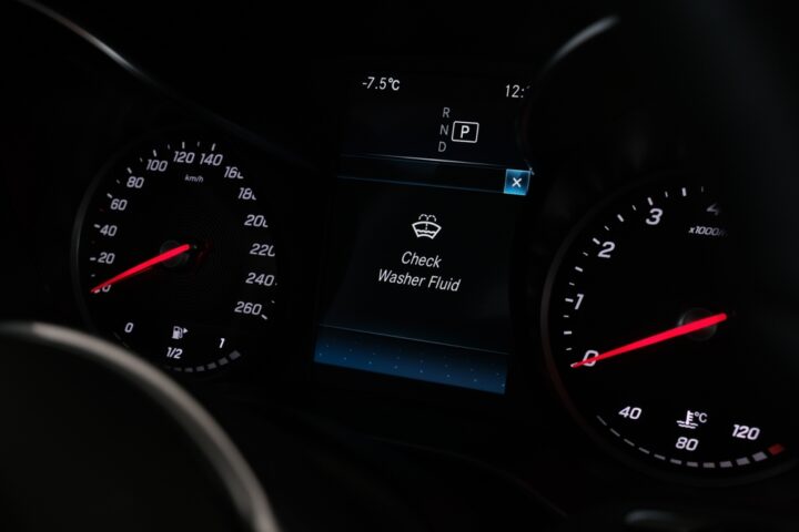 Check washer fluid warning sign in the car dashboard.