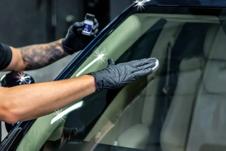 Worker applies nano protective coating to the car. 