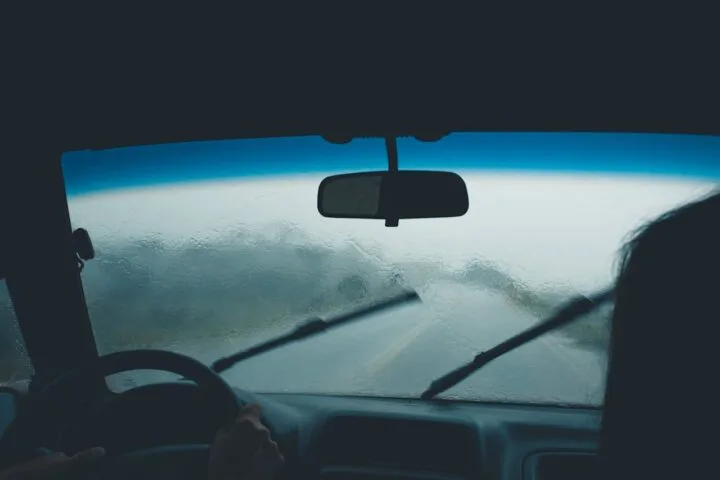 Driving on a heavy rain with wipers on.