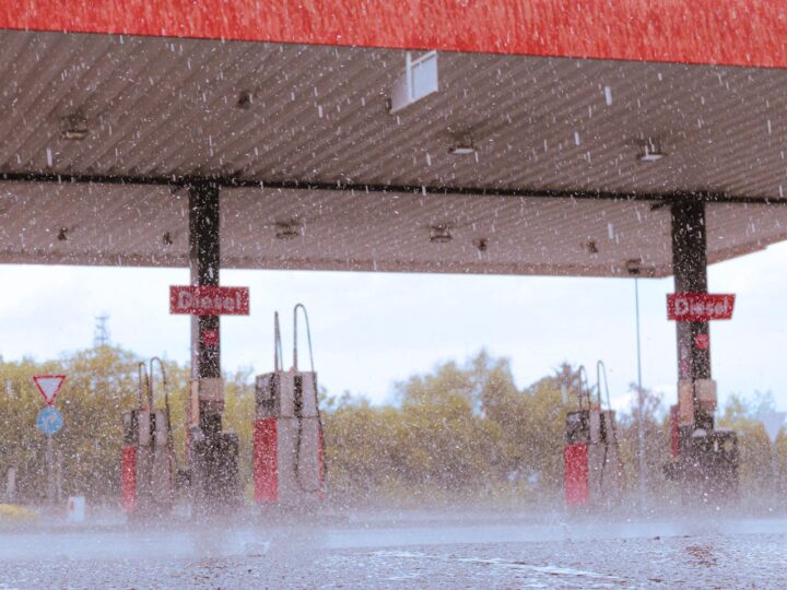 A photo of a gas station in a heavy rainfall.