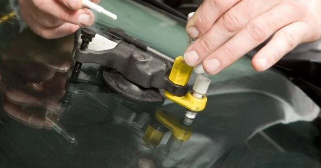 A repair of a rock chip crack in a windshield.