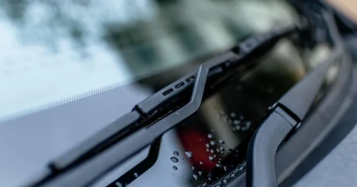 Close up photo of a car windshield wiper.