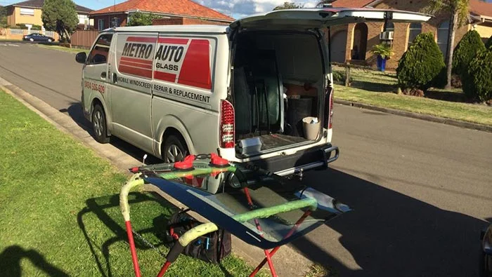 Metro Auto Glass van with new windscreen glass on stand