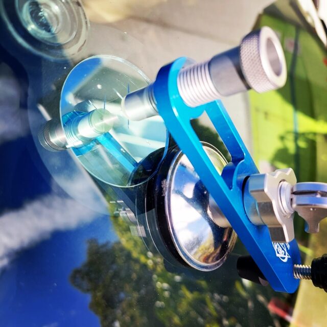 Close up of suction caps on windscreen glass during a chip repair.