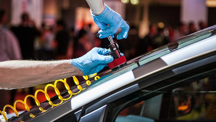 Windscreen chip being repaired with equipment shown on glass