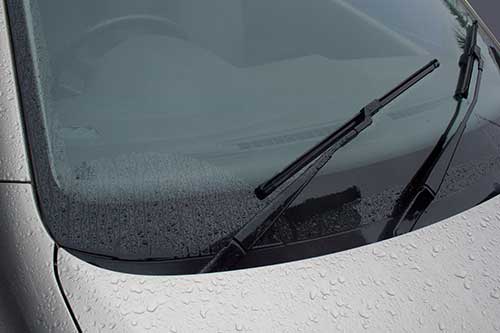 Clean windscreen with wiper blades operating correctly.